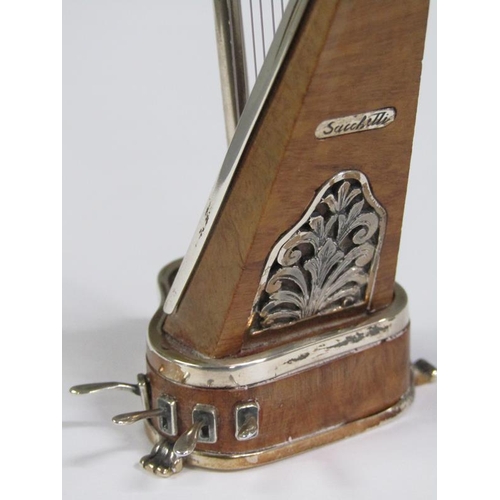 58 - An early 20c miniature model of a harp constructed of wood and white metal, bearing a name plate 'Sa... 