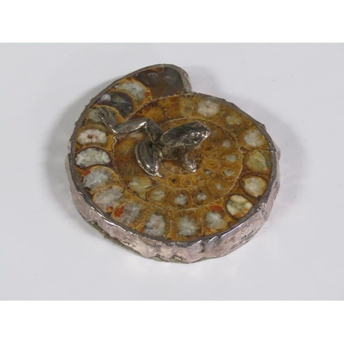 65 - A silver frog on a fossilised stone base, silver mounted with date letters (rubbed), 8cm w.