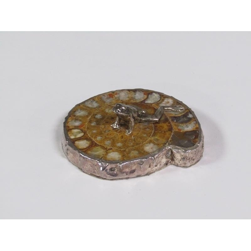 65 - A silver frog on a fossilised stone base, silver mounted with date letters (rubbed), 8cm w.