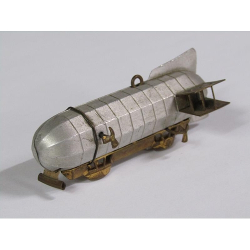 67 - An early 20c novelty tape measure in the form of an airship, silvered and gilt metaled, 8cm l.