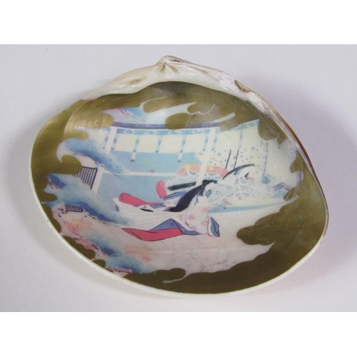 84 - A Meiji period clam shell opening to reveal a painted interior of two figures in a garden setting an... 