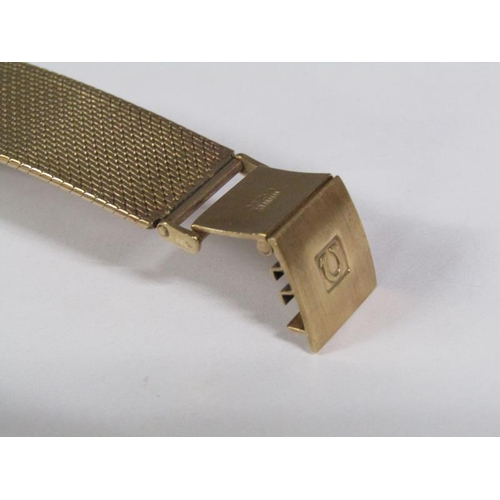 100 - An Omega automatic De Ville 9ct gold gentleman's wristwatch movement and strap, 66g overall.