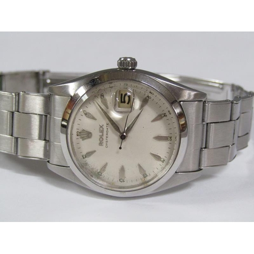 101 - A Rolex Oyster date gentlemen's steel wristwatch with a purchase guarantee dated 8th March 1958 and ... 