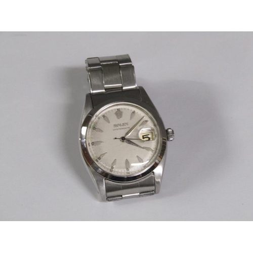 101 - A Rolex Oyster date gentlemen's steel wristwatch with a purchase guarantee dated 8th March 1958 and ... 