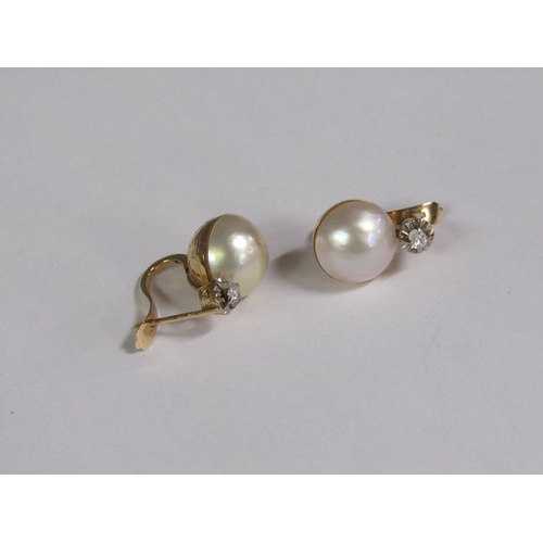 131 - A pair of gold diamond and pearl set earrings.