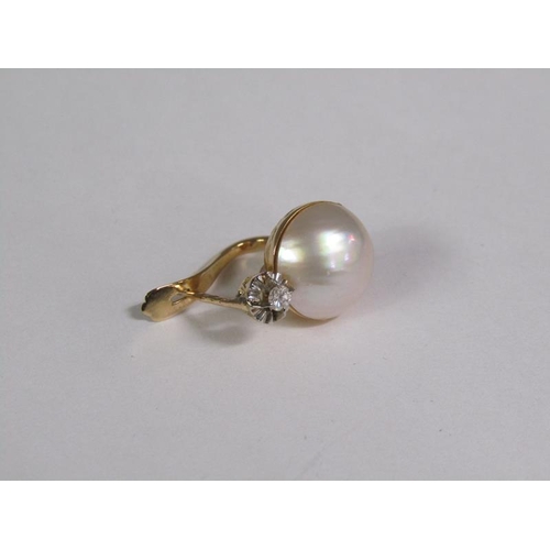 131 - A pair of gold diamond and pearl set earrings.