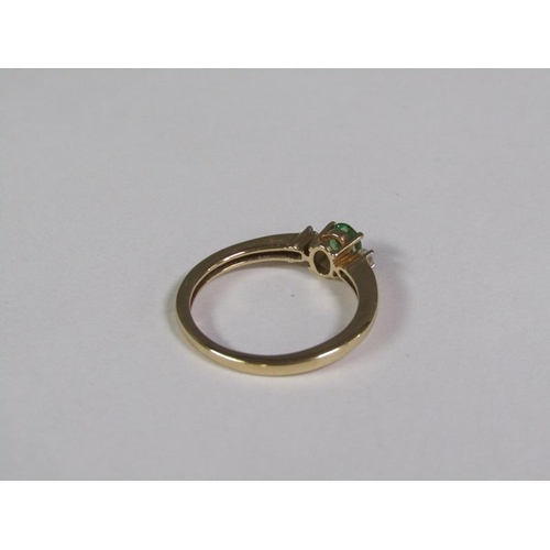 139 - A gold emerald and diamond ring, size O 1/2.