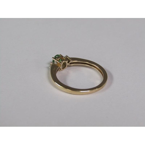 139 - A gold emerald and diamond ring, size O 1/2.