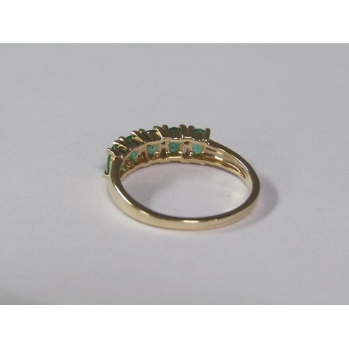 140 - A gold five stone emerald ring, size L 3/4.