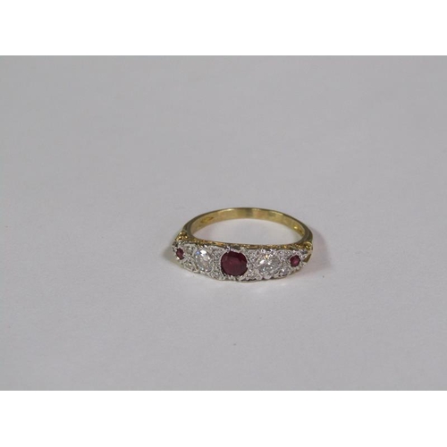 141 - An 18ct ruby and diamond set ring, size Q 1/2.