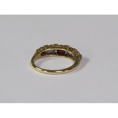 141 - An 18ct ruby and diamond set ring, size Q 1/2.