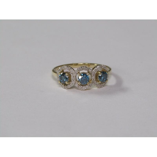 142 - A gold blue and white diamond three stone set ring, size K.