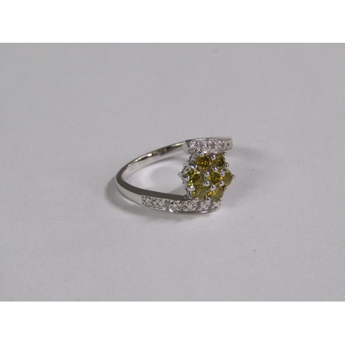 144 - An 18ct fancy yellow and white diamond set ring, size M 1/2.