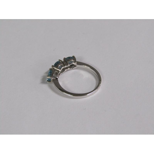 145 - A gold blue zircon and diamond three stone set ring, size J 1/2.