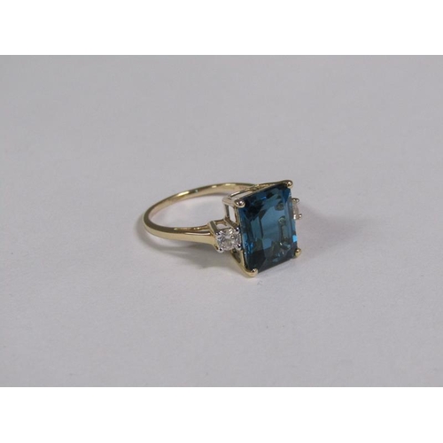 147 - A gold blue topaz and white topaz set ring, size N 1/2.