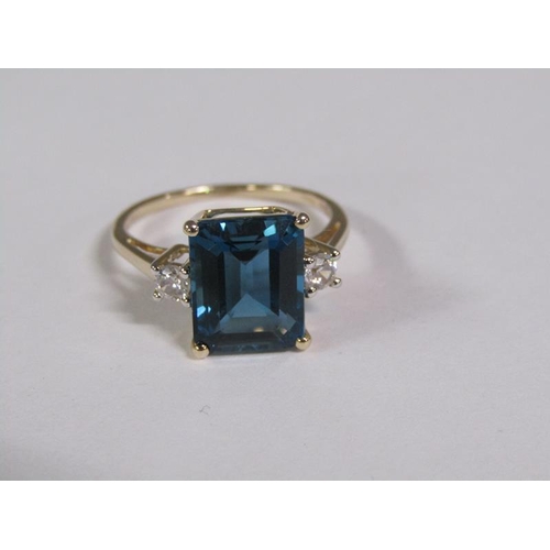 147 - A gold blue topaz and white topaz set ring, size N 1/2.