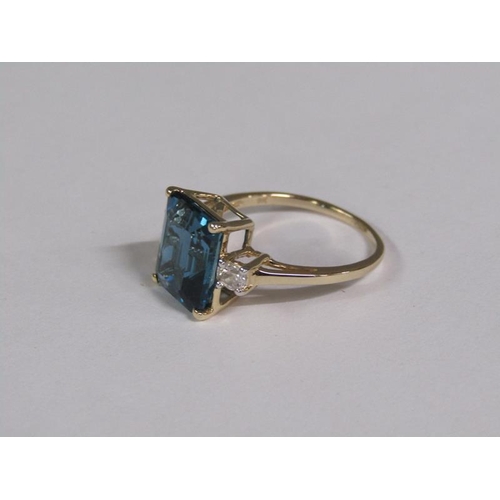 147 - A gold blue topaz and white topaz set ring, size N 1/2.