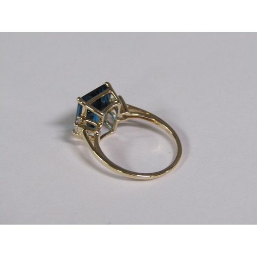 147 - A gold blue topaz and white topaz set ring, size N 1/2.