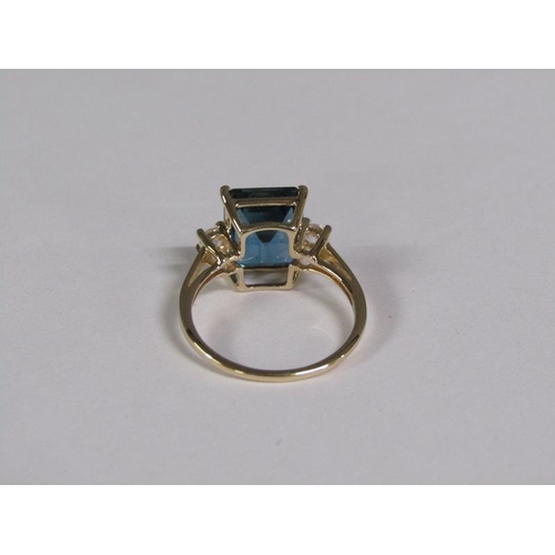 147 - A gold blue topaz and white topaz set ring, size N 1/2.