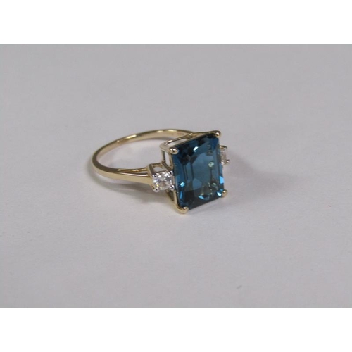 147 - A gold blue topaz and white topaz set ring, size N 1/2.