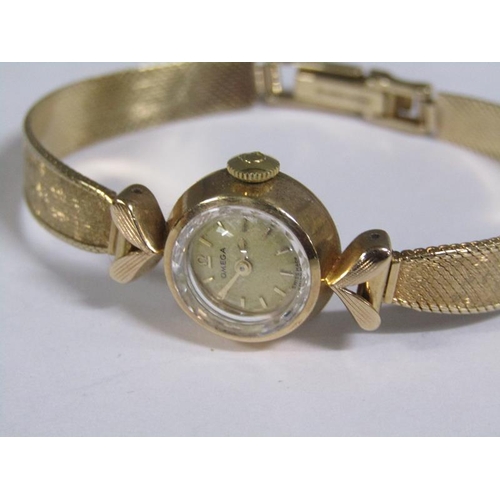 96 - An Omega ladies gold wristwatch with closed plaited two colour strap, 14.7g overall.