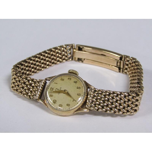 97 - An Omega ladies 9ct gold wristwatch and strap, 31g overall.