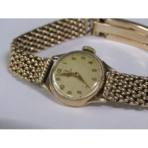 97 - An Omega ladies 9ct gold wristwatch and strap, 31g overall.