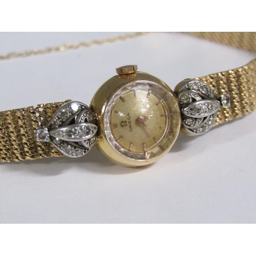 98 - An Omega ladies gold cocktail watch with diamond set hinge mounts, 29g overall.