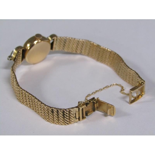 98 - An Omega ladies gold cocktail watch with diamond set hinge mounts, 29g overall.