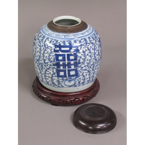 220 - A Chinese blue and white jar painted with four panels of script within trailing leaf and flowers, im... 