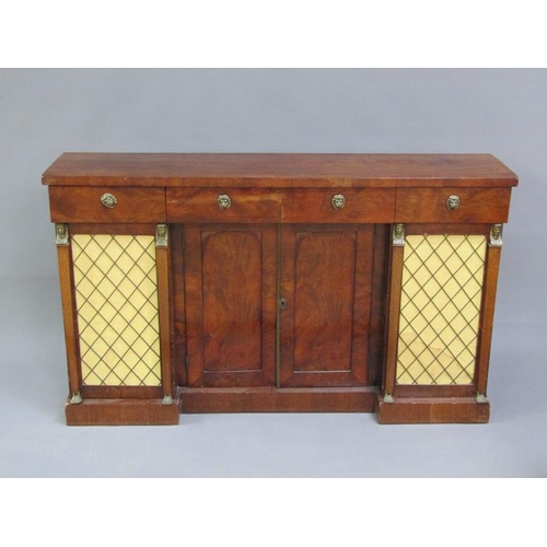 312 - A late Regency style mahogany side cabinet fitted three frieze drawers over central cupboards enclos... 