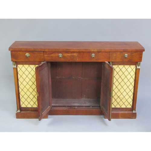 312 - A late Regency style mahogany side cabinet fitted three frieze drawers over central cupboards enclos... 