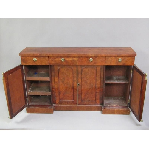 312 - A late Regency style mahogany side cabinet fitted three frieze drawers over central cupboards enclos... 