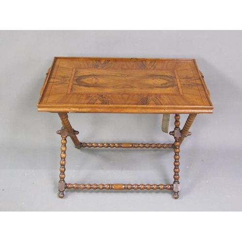 337 - A 19c figured walnut two handled tray with crossbanding and line inlay, supported on a bobbin turned... 