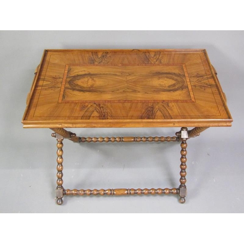 337 - A 19c figured walnut two handled tray with crossbanding and line inlay, supported on a bobbin turned... 