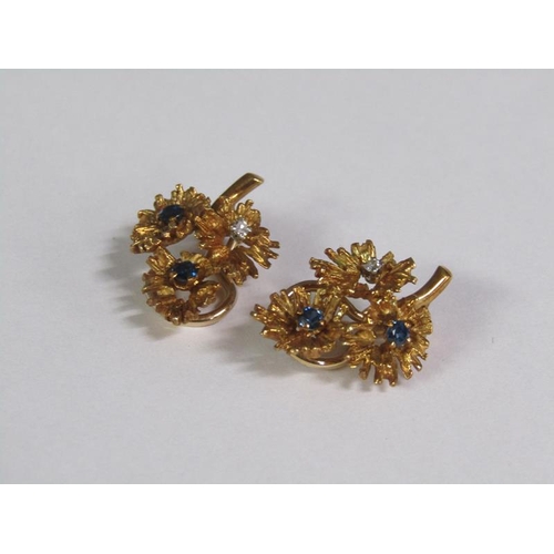 133 - A pair of 18ct gold leaf formed diamond and sapphire set clip earrings.