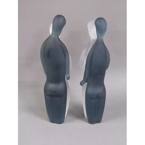 213 - A pair of Murano frosted and clear glass sculpture in the form of a male and female, figures with ar... 