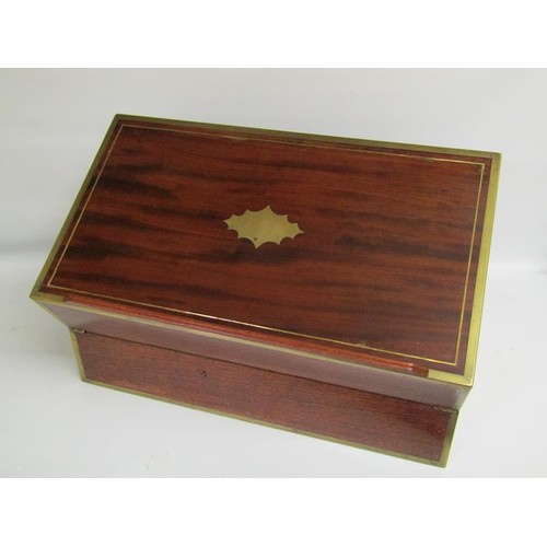 40 - An early 19c mahogany writing box, brass rail inlaid with brass edges and cut motif to the cover, gr... 