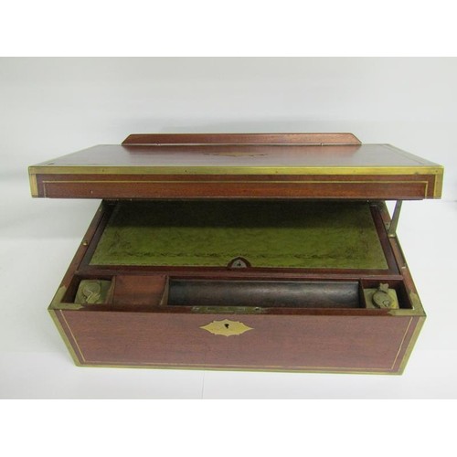 40 - An early 19c mahogany writing box, brass rail inlaid with brass edges and cut motif to the cover, gr... 