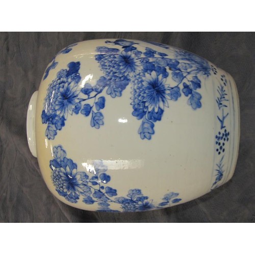 221 - A Chinese blue and white jar painted with birds perched on rocks amongst flowers and blossom, four c... 