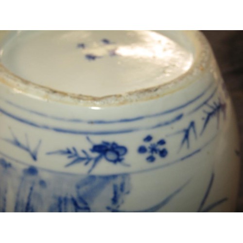 221 - A Chinese blue and white jar painted with birds perched on rocks amongst flowers and blossom, four c... 