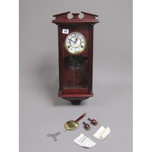 30 - PENDULUM WALL CLOCK IN MAHOGANY CASE