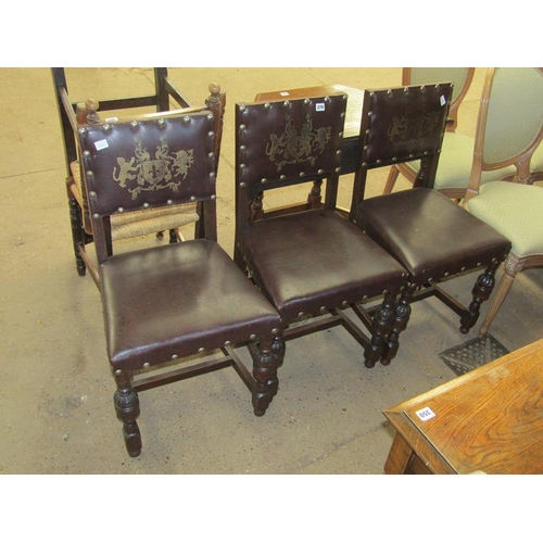 379 - THREE LEATHER UPHOLSTERED DINING CHAIRS