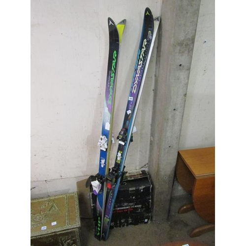 324 - SKIS AND NEW SKI BOOTS