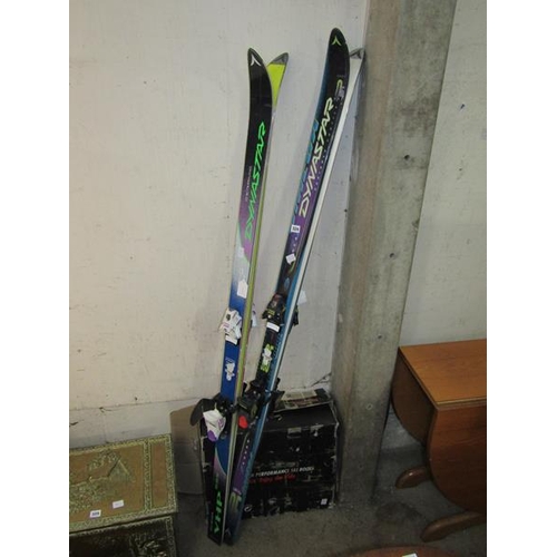 324 - SKIS AND NEW SKI BOOTS