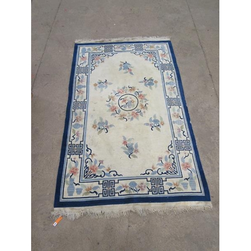 334 - BLUE AND CREAM RUG