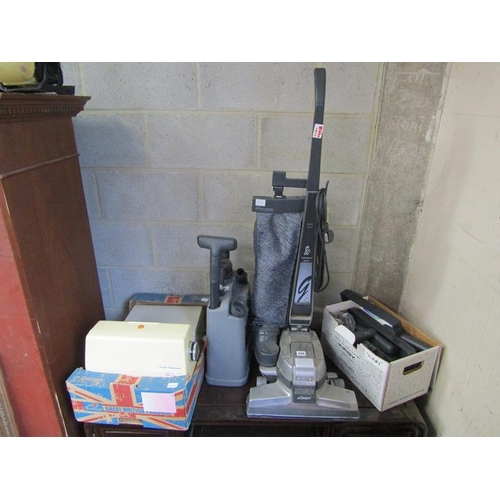 335 - KIRBY VACUUM CLEANER, ACCESSORIES, AND A SEWING MACHINE ETC.