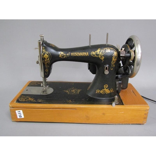 1110 - HUSQVARNA ELECTRICALY OPERATED SEWING MACHINE ON WOODEN BASE, 48CM W