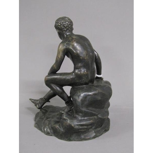 1216 - 19C CAST PATINATED BRONZE FIGURE SEATED ON ROCK, 19CM H