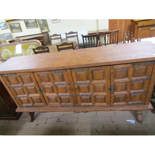 1575 - IBERIAN SPANISH OAK SIDE CABINET ON STAND ENCLOSED BY GEOMETRIC PANEL DOORS, 120CM W